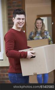 Young Couple Moving In To New Home Together