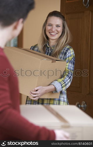 Young Couple Moving In To New Home Together