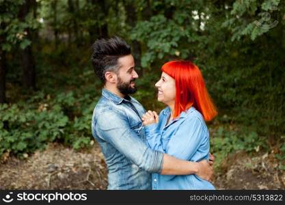 Young couple of lovers embracing in the park