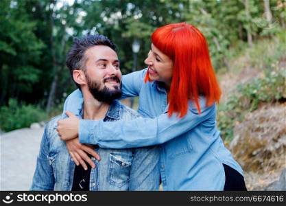 Young couple of lovers embracing . Young couple of lovers embracing in the park