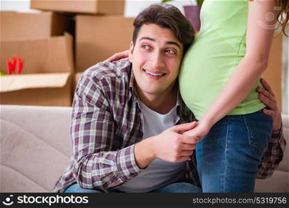 Young couple of man and pregnant wife expecting baby
