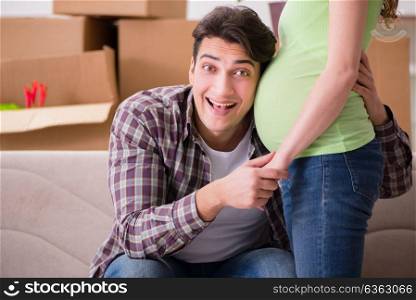 Young couple of man and pregnant wife expecting baby