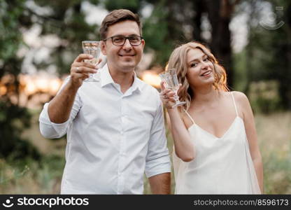 young couple of newlyweds on a walk in a pine forest