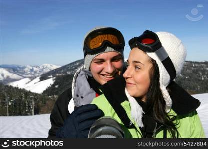Young couple on a ski slope