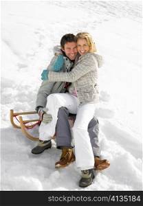 Young Couple On A Sled