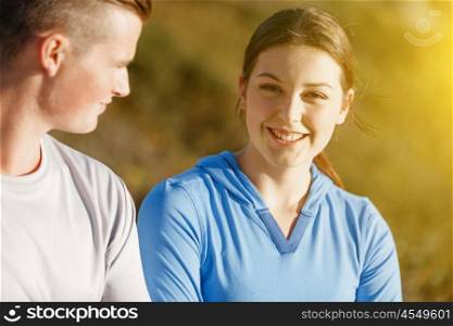Young couple on beach in sportwear. Young couple on beach wearing sportwear