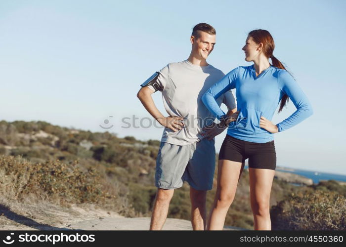 Young couple on beach training together. Young couple on beach training and exercising together