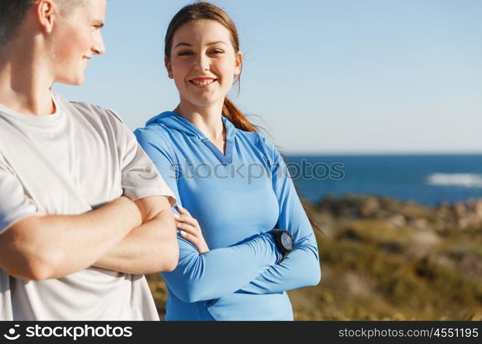 Young couple on beach training together. Young couple on beach training and exercising together