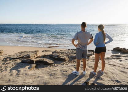 Young couple on beach training together. Young couple on beach training and exercising together