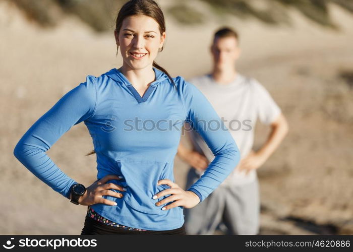 Young couple on beach training together. Young couple on beach training and exercising together