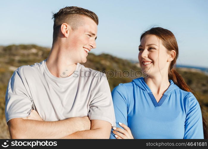 Young couple on beach training together. Young couple on beach training and exercising together