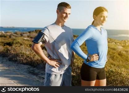 Young couple on beach training together. Young couple on beach training and exercising together