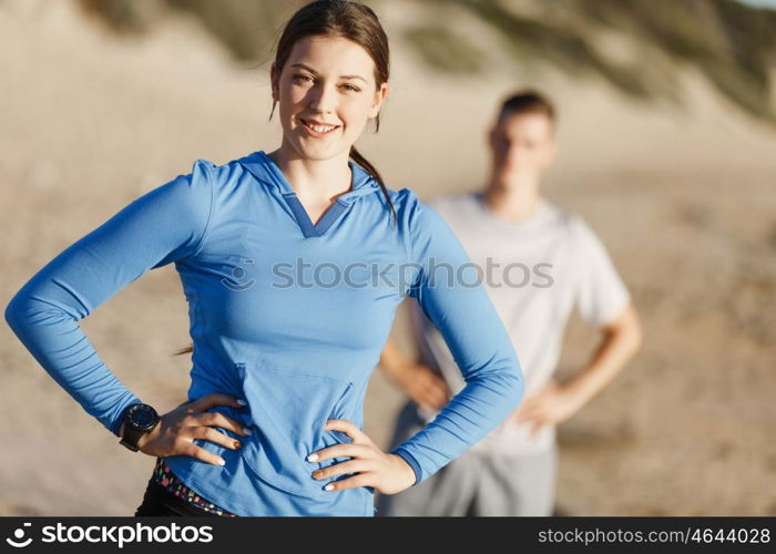 Young couple on beach training together. Young couple on beach training and exercising together