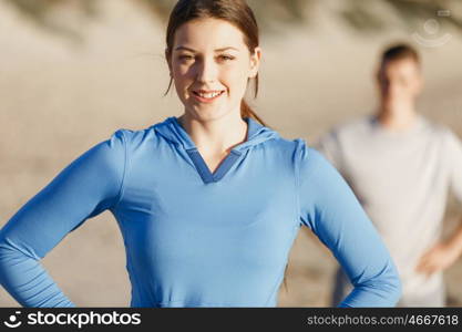 Young couple on beach training together. Young couple on beach training and exercising together