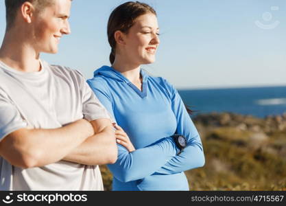 Young couple on beach training together. Young couple on beach training and exercising together