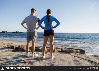 Young couple on beach training together. Young couple on beach training and exercising together