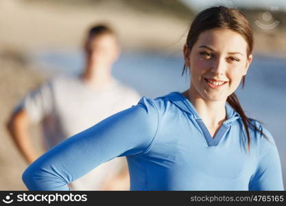 Young couple on beach training together. Young couple on beach training and exercising together