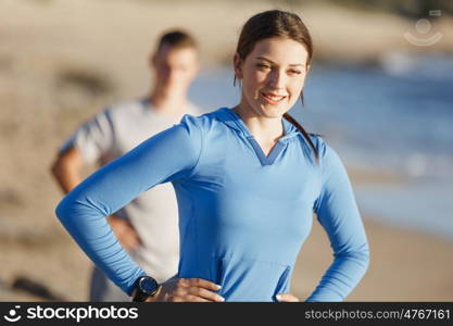 Young couple on beach training together. Young couple on beach training and exercising together