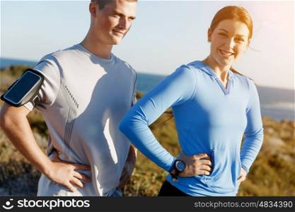 Young couple on beach training together. Young couple on beach training and exercising together