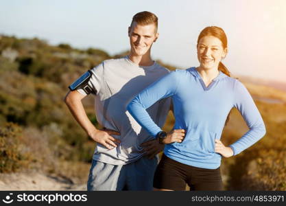 Young couple on beach training together. Young couple on beach training and exercising together