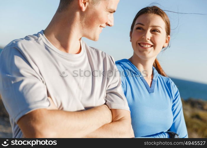 Young couple on beach training together. Young couple on beach training and exercising together