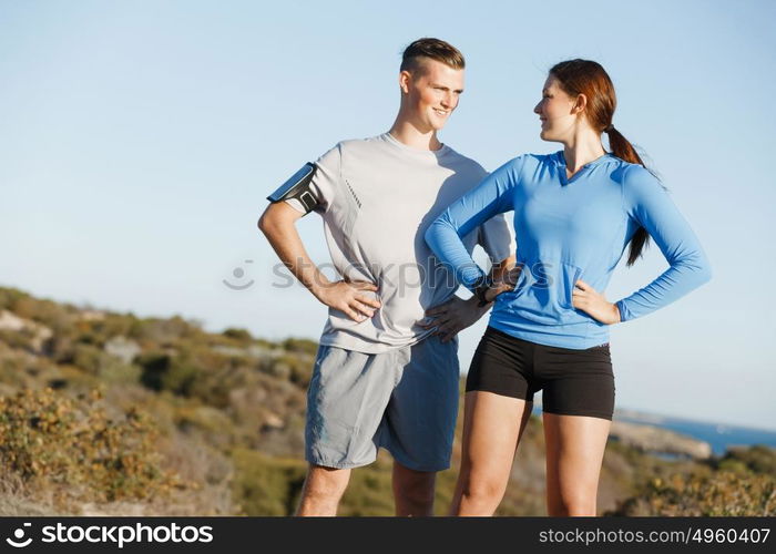 Young couple on beach training together. Young couple on beach training and exercising together