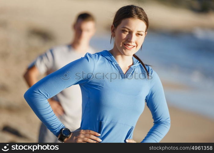 Young couple on beach training together. Young couple on beach training and exercising together