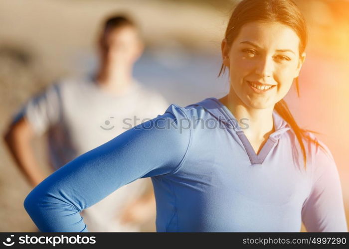 Young couple on beach training together. Young couple on beach training and exercising together