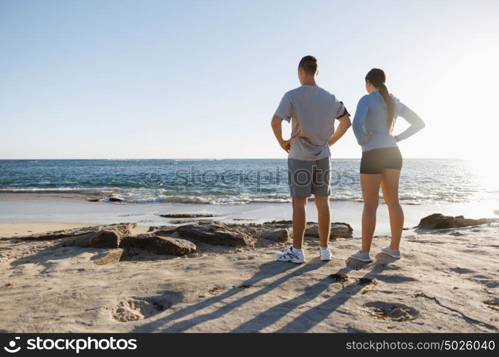 Young couple on beach training together. Young couple on beach training and exercising together