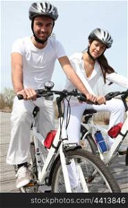 young couple on bicycle