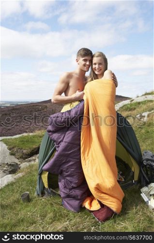 Young Couple On Camping Trip In Countryside