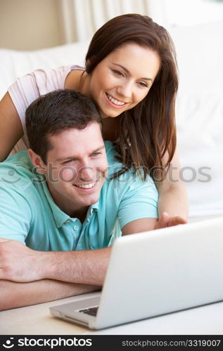 Young couple on laptop computer