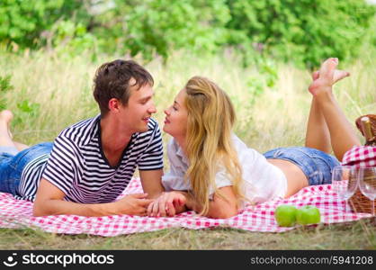 Young couple on picnic at forest
