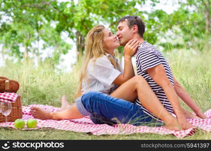 Young couple on picnic at forest