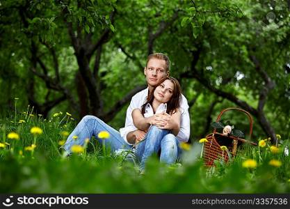 Young couple on picnic in a summer park
