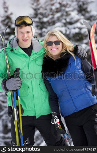 Young Couple On Ski Holiday In Mountains