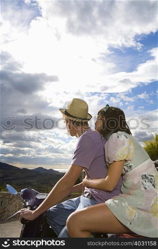 Young couple on vespa
