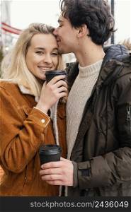 young couple outdoor enjoying cup coffee 2