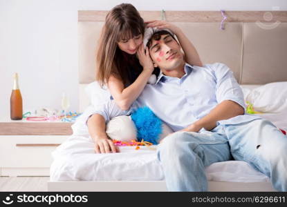 Young couple partying in the bed