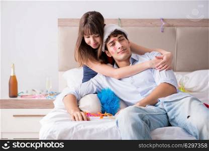 Young couple partying in the bed