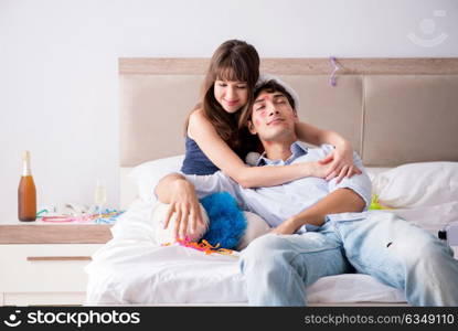 Young couple partying in the bed