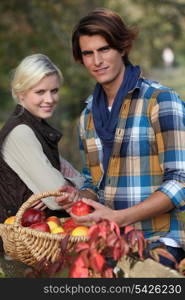 Young couple picking apples