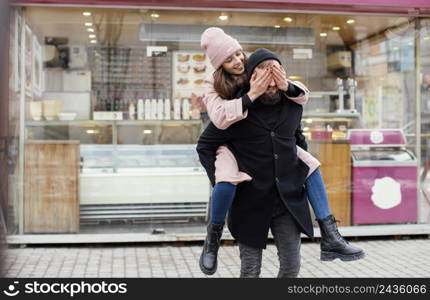 young couple piggy back ride 6