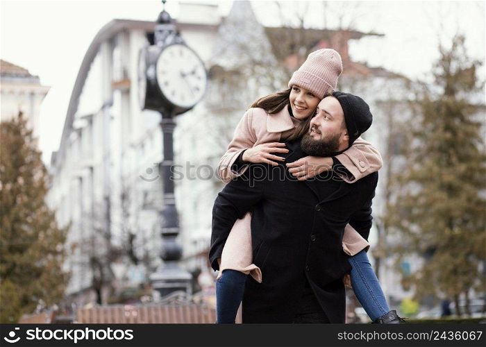 young couple piggy back ride 7