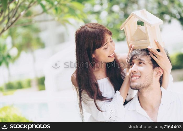 Young couple planning to buy a house and have happy living.. Young couple planning to buy a house concept.