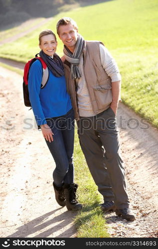 Young couple pose in park