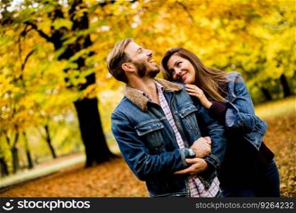 Young couple posing in the autumn park