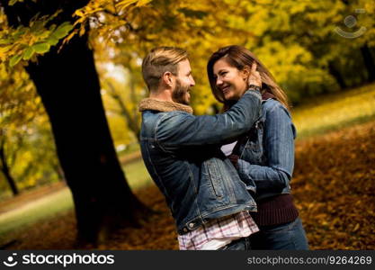 Young couple posing in the autumn park