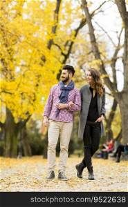 Young couple posing  in the autumn park