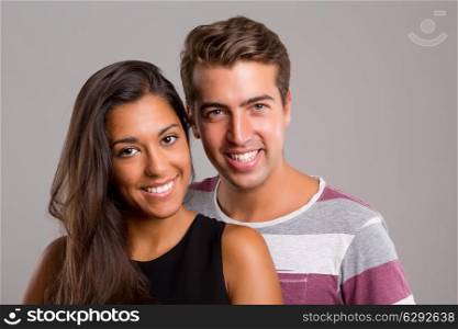 Young couple posing isolated in studio